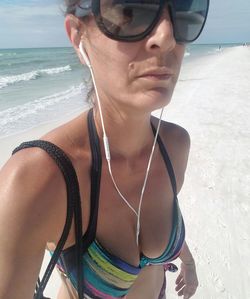 Young woman wearing sunglasses on beach