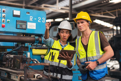 Rear view of man working at construction site