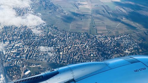 Aerial view of cityscape against sky