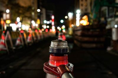 Close-up of illuminated candles on street