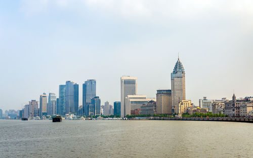 Modern buildings in city against sky