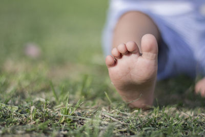 Baby foot sitting in a park