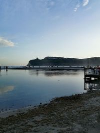 Scenic view of bay against sky