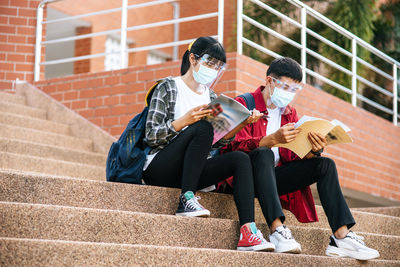 People sitting on staircase