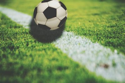 Close-up of soccer ball on field