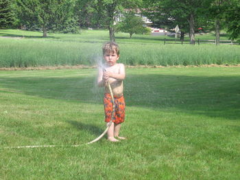 Full length of boy in grass