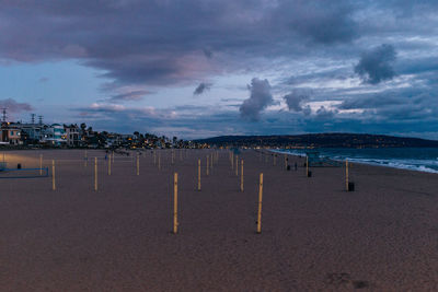 View of beach against cloudy sky