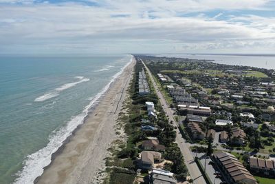 High angle view of beach against sky in city