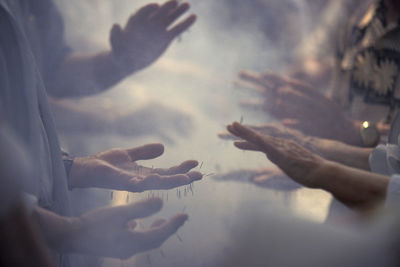 Cropped image of people getting acupuncture treatment