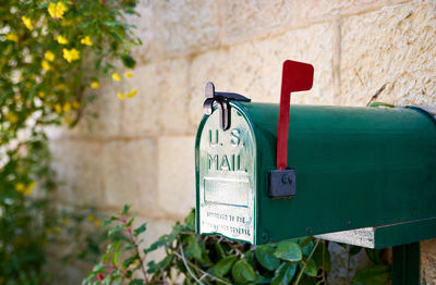 Close-up of mailbox mounted on wall