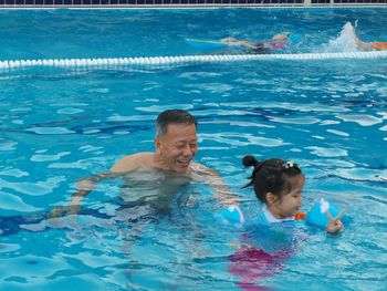 Boy swimming in pool