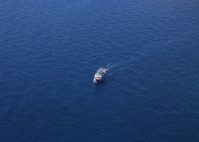 High angle view of ship sailing on sea