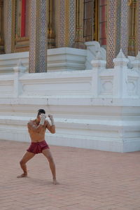 Shirtless man at temple