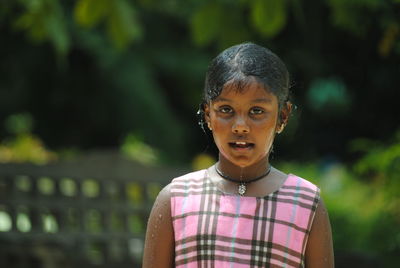 Portrait of wet girl during rainy season