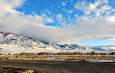 Scenic view of snowcapped mountains against sky