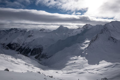 Scenic view of snow covered mountains