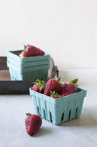 Close-up of strawberries in basket on table