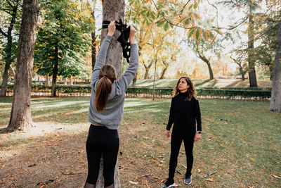 Mid adult women exercising at park