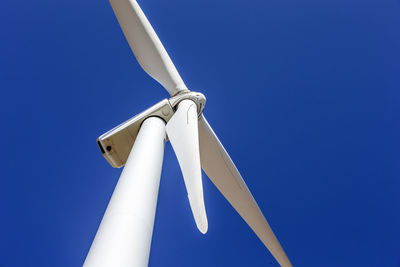 Wind turbine in colorado against blue sky
