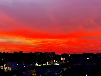 High angle view of illuminated buildings against sky during sunset