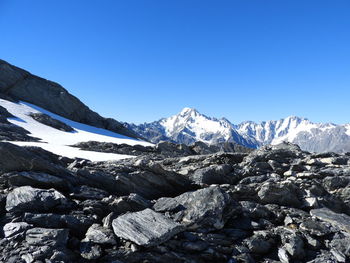 Scenic view of mountains against clear blue sky