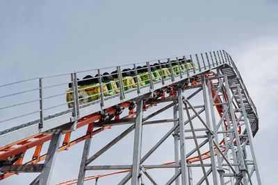 Low angle view of rollercoaster against sky