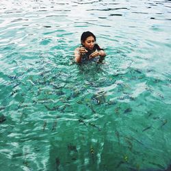 Portrait of young woman in swimming pool