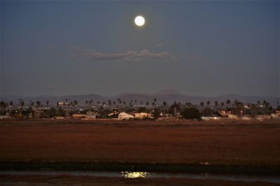 Scenic view of land against sky at night