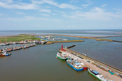 High angle view of boats in sea against sky