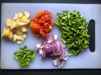 High angle view of chopped vegetables on cutting board