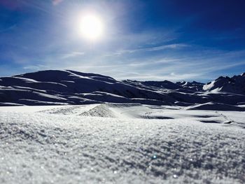 Scenic view of snow covered landscape against sky