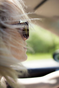 Close-up of young woman in sunglasses