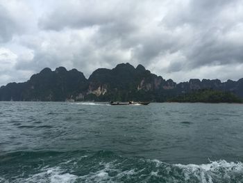 Scenic view of sea against cloudy sky