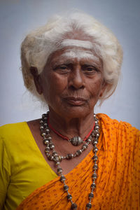 Close-up portrait of smiling mid adult woman