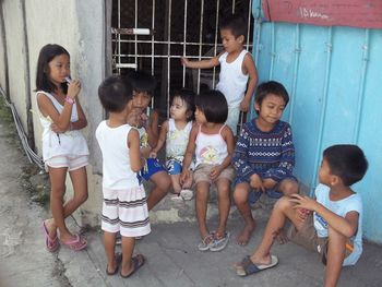 Group of people sitting outdoors