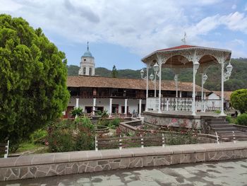View of temple building against cloudy sky