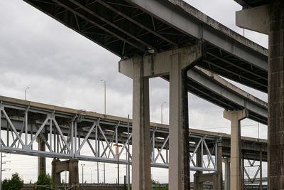 Low angle view of railway bridge against sky