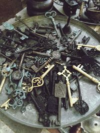 High angle view of old keys in plate