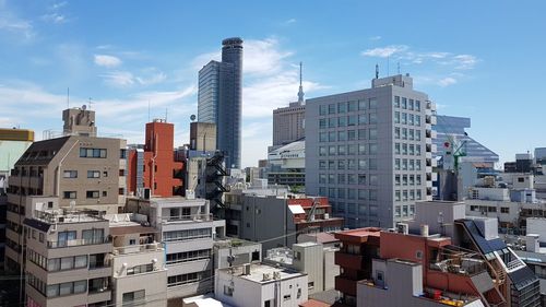 Modern buildings in city against sky