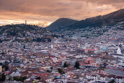 High angle shot of townscape against sky at sunset