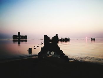 Scenic view of sea against clear sky during sunset