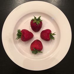 High angle view of strawberries in plate