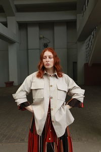 Midsection of young woman standing in bathroom