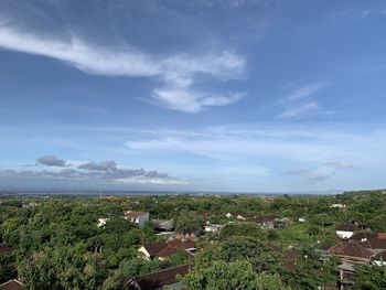 High angle view of trees and buildings against sky