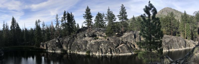 Panoramic view of lake in forest against sky