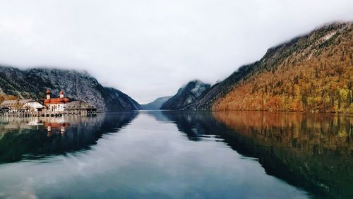 Scenic view of lake and mountains against sky