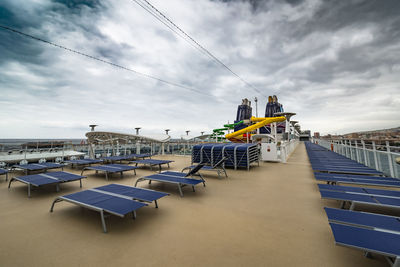 View of empty chairs against the sky