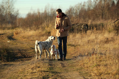 Man with dog on field