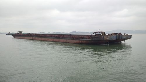 View of ship in sea against sky