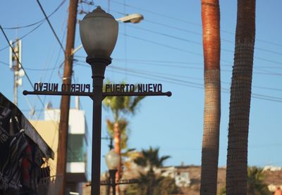Low angle view of street light against sky
